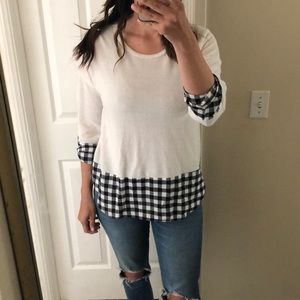 White sweater with black and white detailing